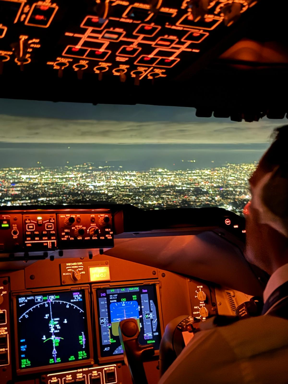 Cockpit view at night during an Aviall Group charter approach